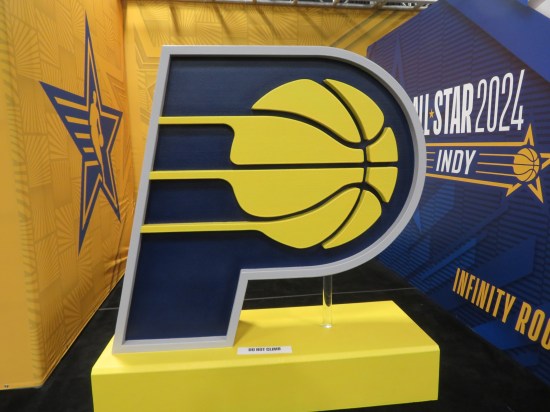A large Pacers team logo on a pedestal.