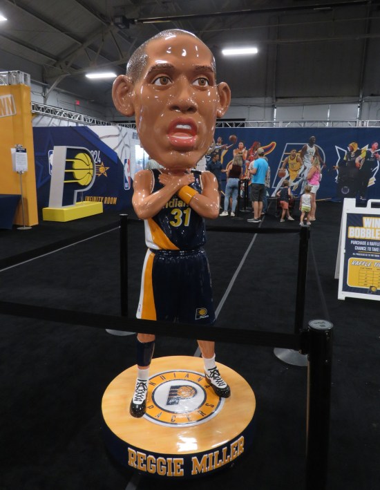 A Reggie Miller giant bobblehead, choking itself.