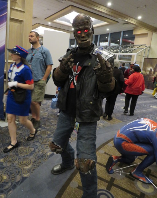 Robotman in a Dead Kennedys shirt, giving us double middle fingers.
