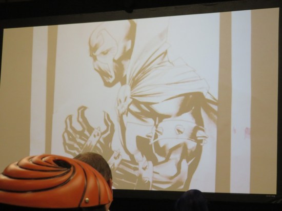 A Spawn sketch projected onto a large screen.