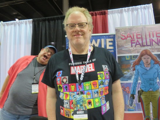 Steve Horton at his table, photobombed by Russell Lissau.