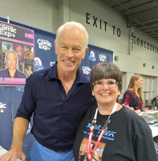 Anne with Neal McDonough at his table.