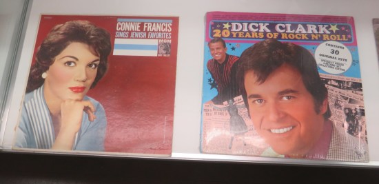 Two vinyl records in a vitrine: "Connie Francis Sings Jewish Favorites" and the anthology "Dick Clark: 20 Years of Rock N' Roll".