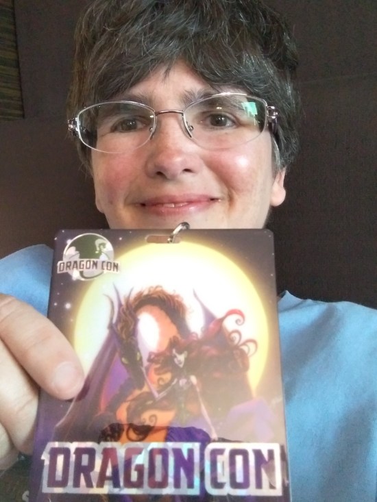 Anne holding her badge.