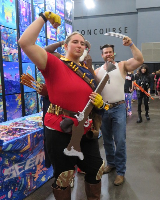 cosplay: Gaston from "Beauty and the Beast" posing with Wolverine in his 2000 wife-beater shirt.