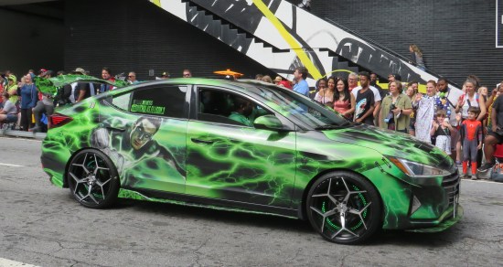 A Green Lantern-themed car, green energy craclking everywhere.