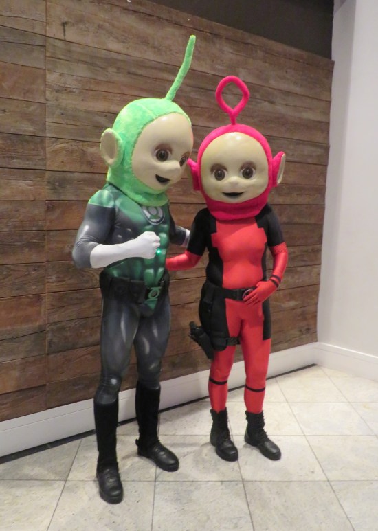 cosplay: two TeleTubbies dressed like superheroes that have been played by Ryan Reynolds.