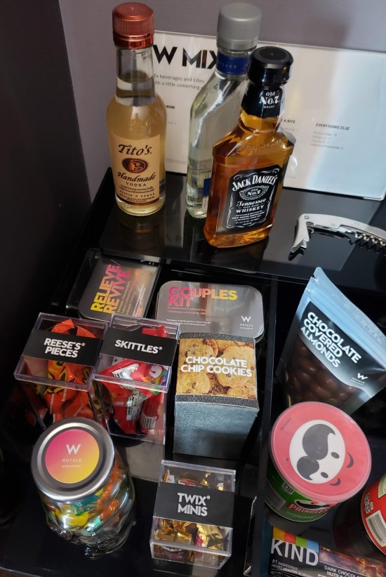 A bunch of alcohol, candy, and "adult" whoopee accessories for sale.