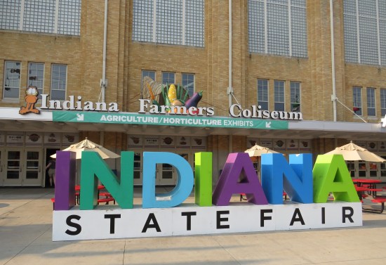 Indiana State Fair big logo on the ground in front of the fairground coliseum entrance.