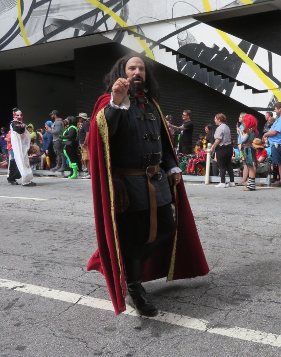Nandor cosplayer, who looks like he's wearing Doctor Strange's cape.