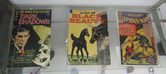 three old comics in a vitrine.
