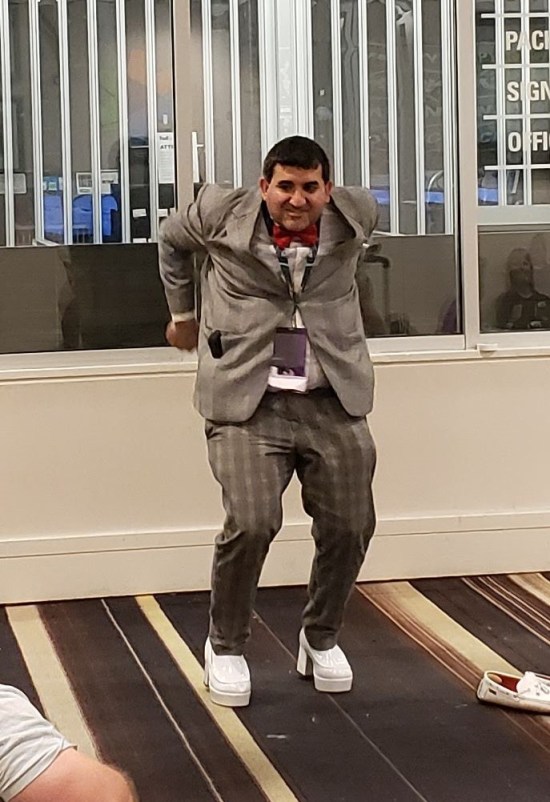 cosplay: Pee-Wee Herman in thick-soled shoes.