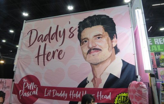 Giant sign with Pedro Pascal's painted face saying "Daddy's Here".