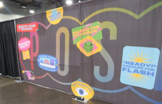 A wall banner with tips for how photo ops work.