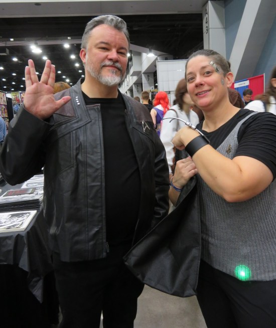 cosplay Riker doing a Vulcan salute, and Seven of Nine. Both have the blacker costumes of their most recent TV series.