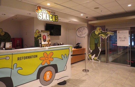 A snack stand called Scooby Snacks, whose decor includes a Mystery Machine and a couple of hulking ghosts.