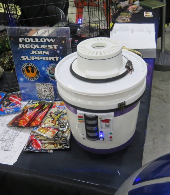 A fake ice cream maker and a fundraiser sign.