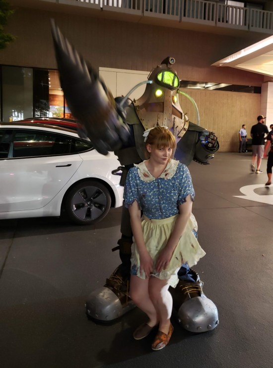 cosplay: Subject Delta and Little Sister outside the Hyatt at night.