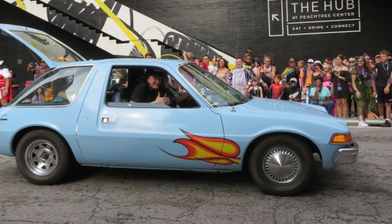 Wayne's World AMC Pacer. Wayne cosplayer in the passenger seat gives us two thumbs-up.