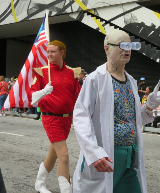 costumes: Zapp Brannigan with American flag and Professor Farnsworth with Marriott Carpet shirt.