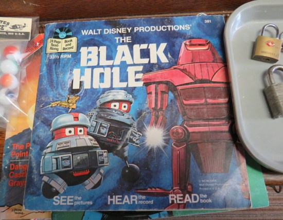 A Disney "Black Hole" storybook and 45 record with the movie's robots on the cover.
