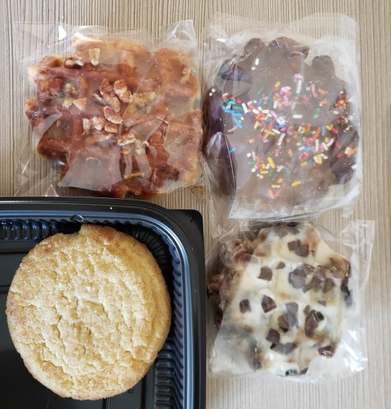 Three dipped waffles in separate baggies and a snickerdoodle. Refer to caption.