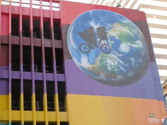 Closeup of the upper-right corner of the Armstrong mural, which has the silhouette of ET and Elliott flying on their bike in front of the earth (a la the old Amblin Entertainment logo).