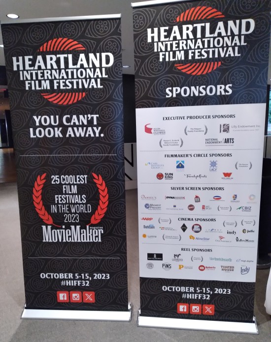 Two tall Heartland banners listing slogans, endorsements, and all corporate sponsors.