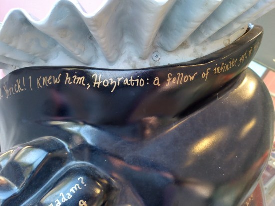 Under the same Hamlet pig's collar is written, "Poor Yorick! I knew him, Hogratio: a fellow of infinite jest..."