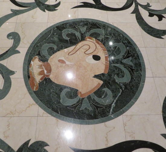 Floor painting of Chip the living teacup from from Disney's "Beauty and the Beast".