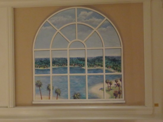 Window painted to appear as if it had an ocean view.