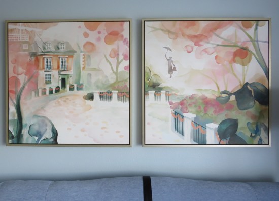 A pair of impressionist watercolor paintings depicting Mary Poppins' floating umbrella arrival at the Banks mansion.