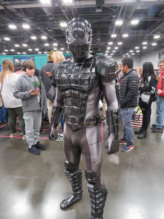 cosplayer in gray-and-silver Spider-Man armor, as appeared in actual Spider-Man comics
