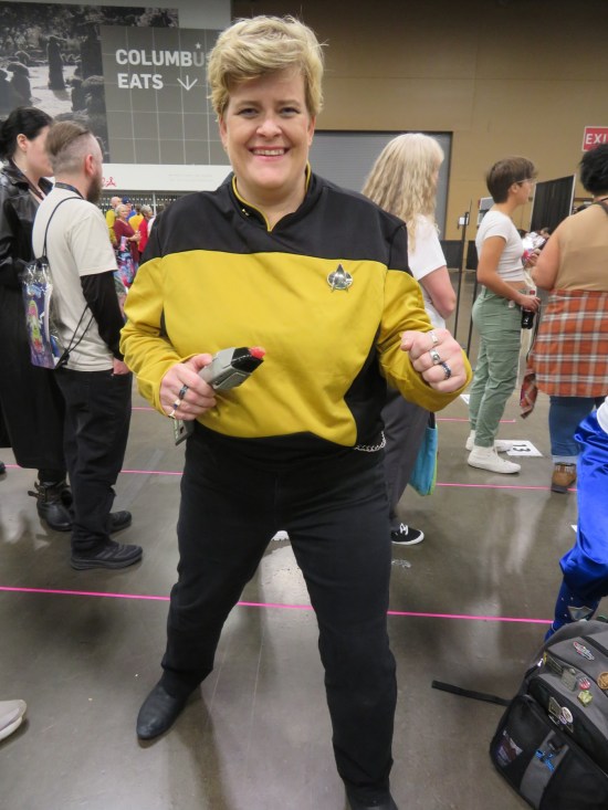 Tasha Yar cosplayer armed with phaser.