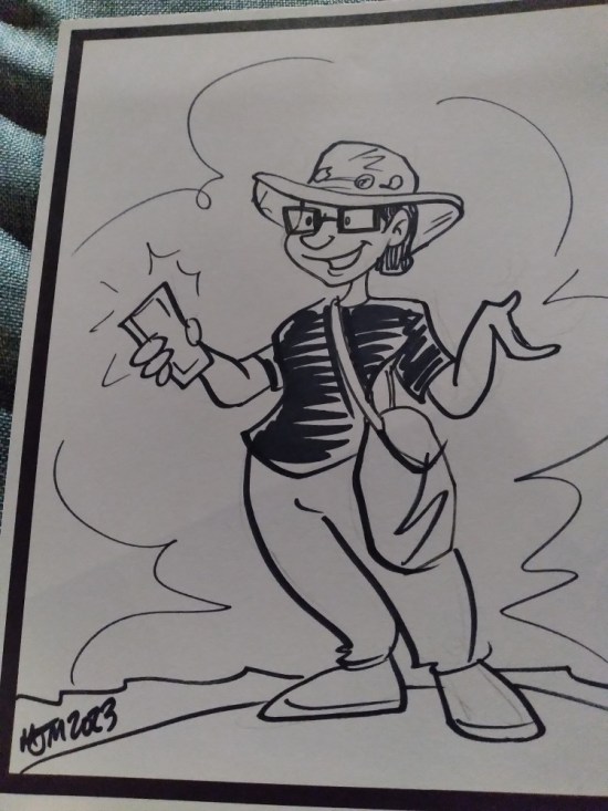 An ink cartoon of Anne with square glasses, phone, safari hat, and giant travel bag.