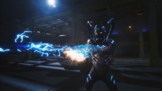 Nighttime battle in which Blue Beetle's suit has manifested an electrified long sword.