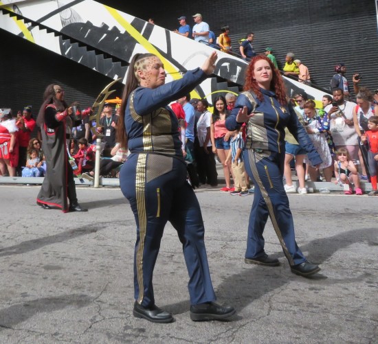 Two Dragon Con parade cosplayers in Star Trek: Discovery uniforms.