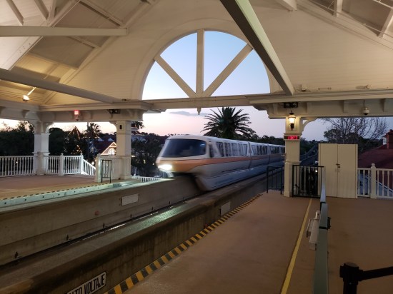 A monorail pulling into the station shortly before sundown.
