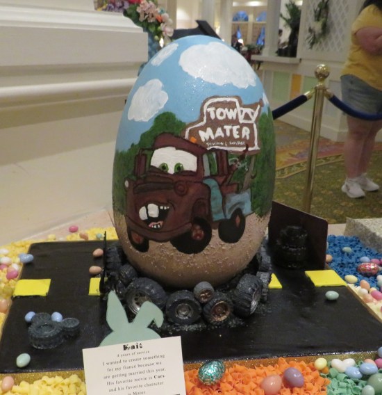 Egg painted with a living googly-eyed bumpkin tow truck who's bucktoothed like me.