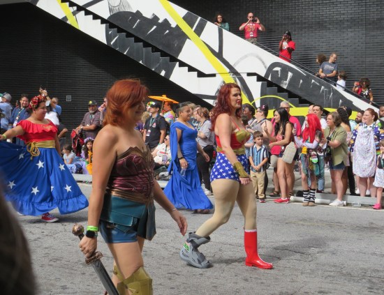 Atlanta parade including three women in Wonder Woman costume and one young lady in a blue faux Greco-Roman robe.
