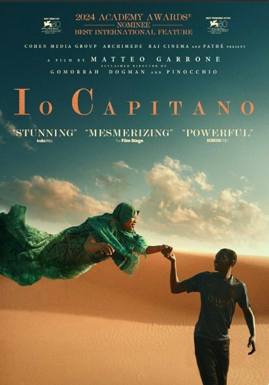Google Wallet screen shot of the mMovie poster for "Io Capitano": Black teen walks through the Sahara Desert while a smiling African woman flies behind him and holds his hand.