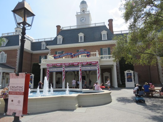 Red, white and blue two-story theater whose sole offering is an "exclusive showing" of something called "The American Adventure".