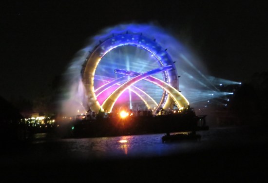 Zoom in on Stargate with three curved pillars turned to overlap it. in blue and yellow.