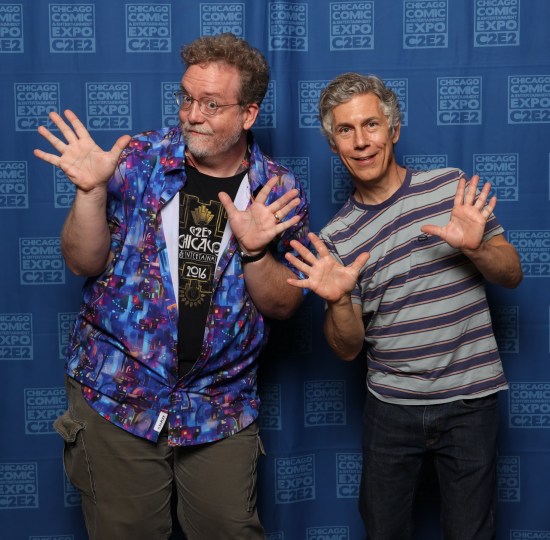 Me doing jazz hands with Chris Parnell, who's wearing a black-and-grey striped shirt. The photog ordered me to put my chin down.