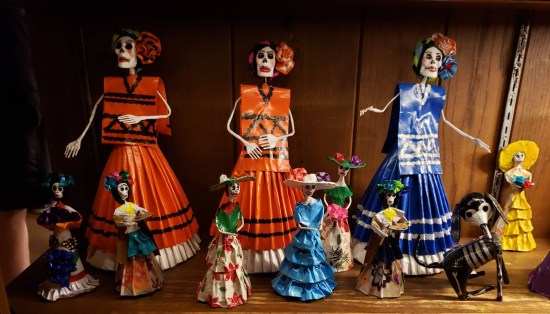 Cute Day of the Dead figurines, mostly matronly skeletons and one skeleton dog.