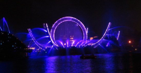 Purple stargate and curved pillars, blue fountains, all winding down into darkness.