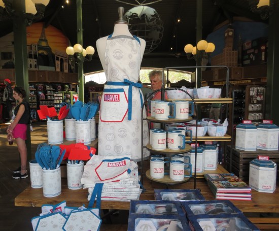 Marvel gift shop with merch including cooking utensils, mugs, aprons, bowls and canisters.