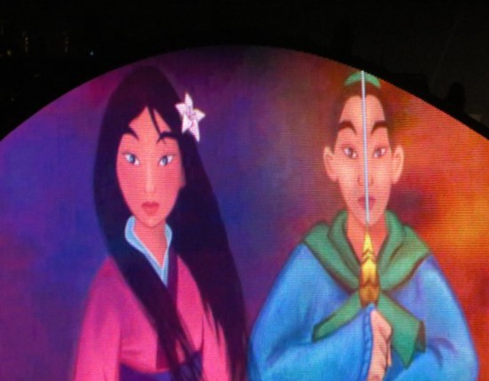 Archway closeup: Mulan and her male soldier disguise, side by side.