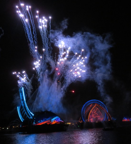 Left archway has fireworks and smoke streams practically erupting from it, straight up.