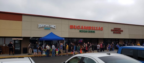 Downtown Comics North with a tent in front and a long line down the block.